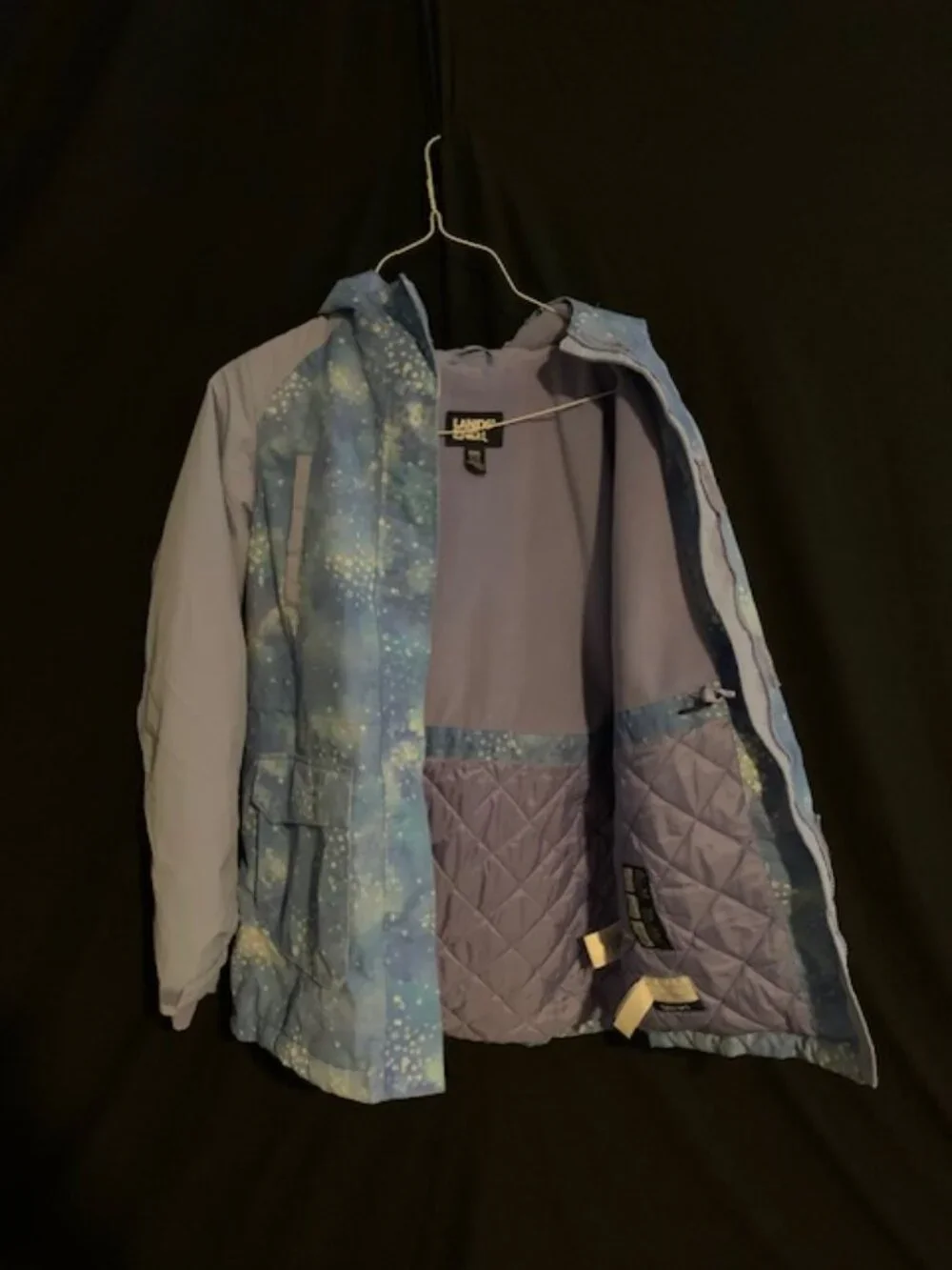 Winter Jacket with Blue‑Teal Pattern & Purple Sleeves – Bold & Cozy